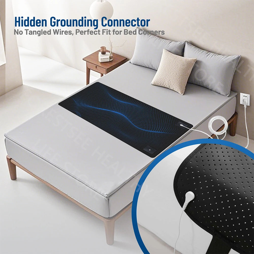 Mattress pad with hidden grounding connector on a bed in a bedroom setting